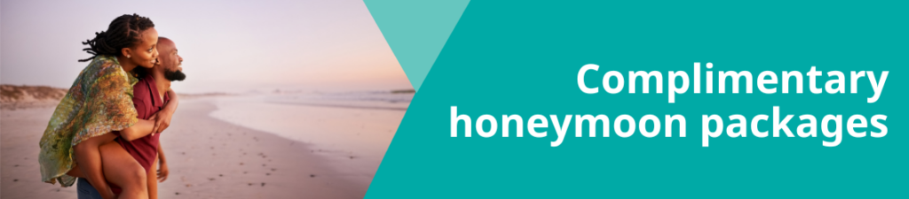 Complimentary honeymoons, couple piggybacking on the beach